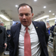 Sen. Mike Lee (R-Utah) walks past reporters inside the U.S. Capitol on July 18, 2017, in Washington, D.C. Sen. Lee said he would vote no to Senate Majority Leader Mitch McConnell’s bid to overhaul the Affordable Care Act. (Mark Wilson/Getty Images)